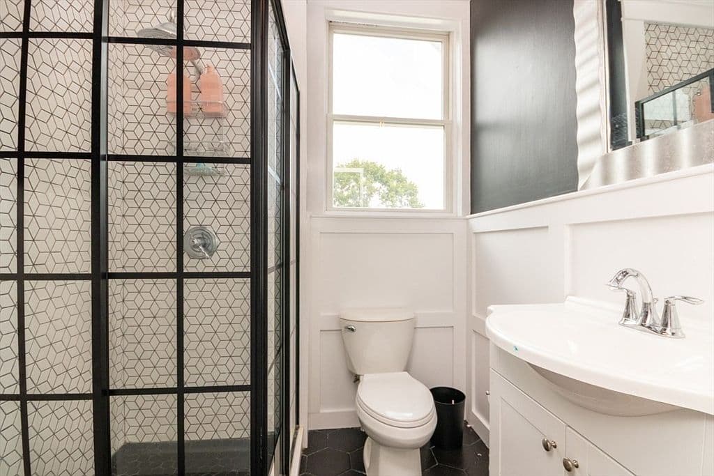 Bathroom with black shower frame