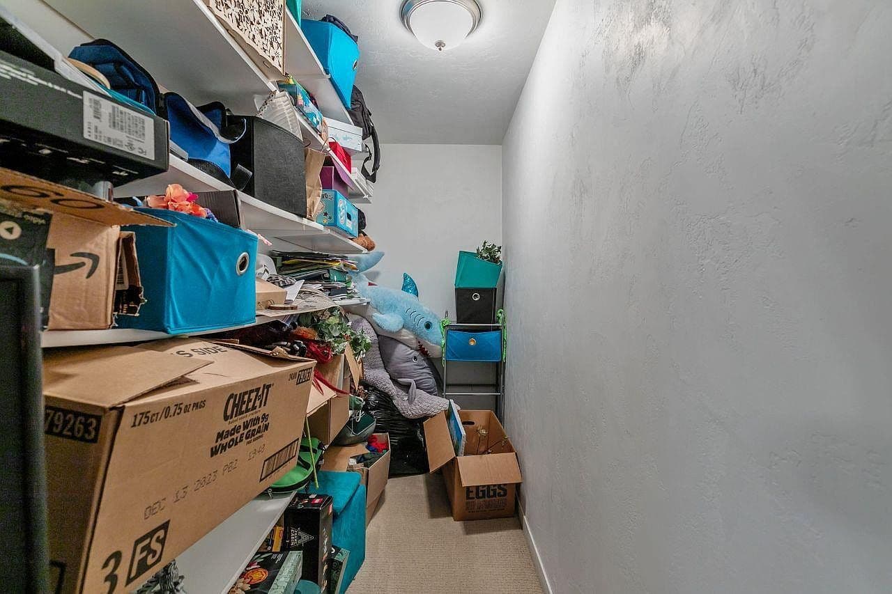 Disorganized Walk-In Closet