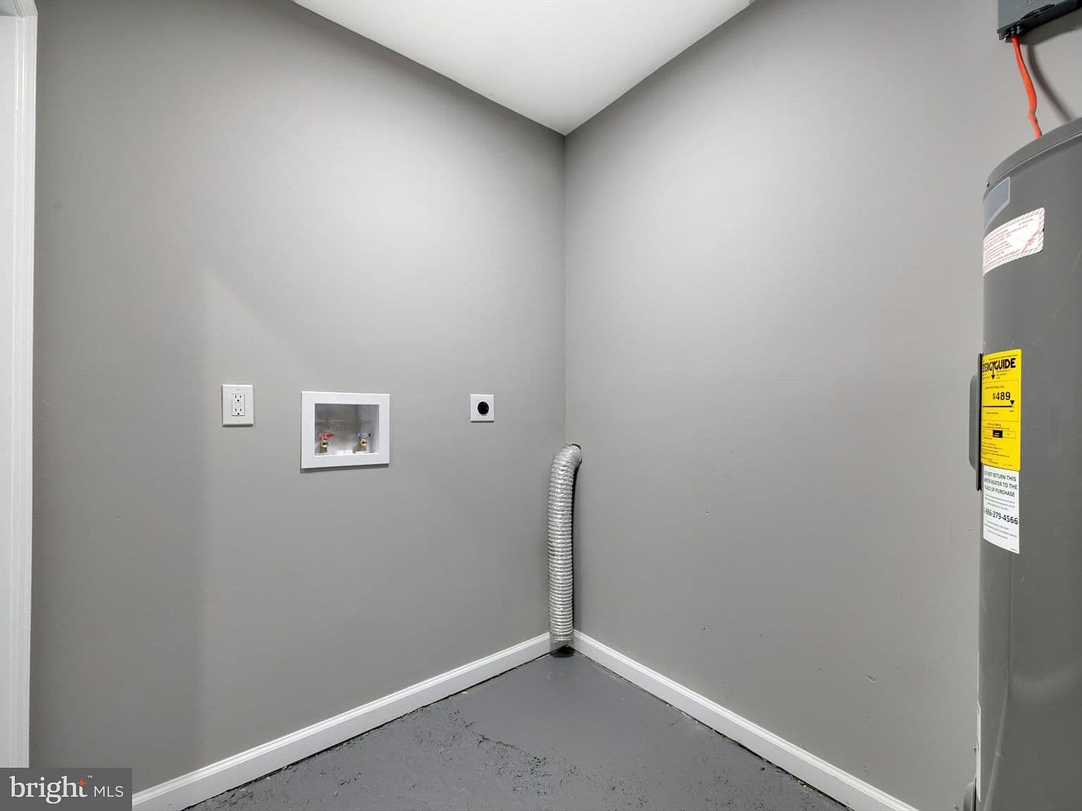 Exposed Plumbing in Laundry Area