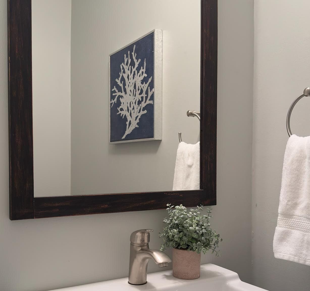 Outdated Bathroom Mirror and Faucet